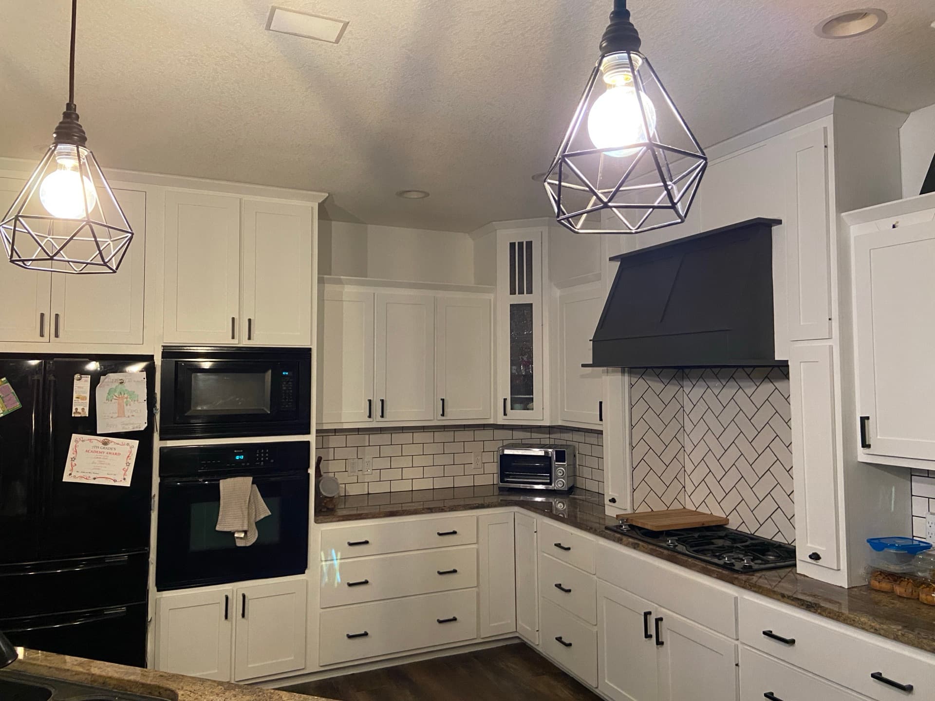 Custom kitchen with herringbone backsplash by Seeger & Co