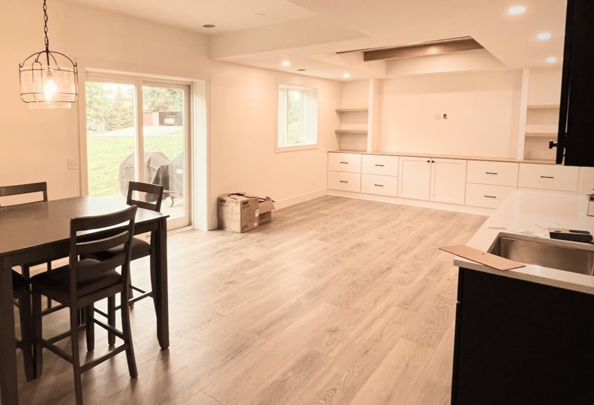 Finished basement entertainment area by Seeger & Co