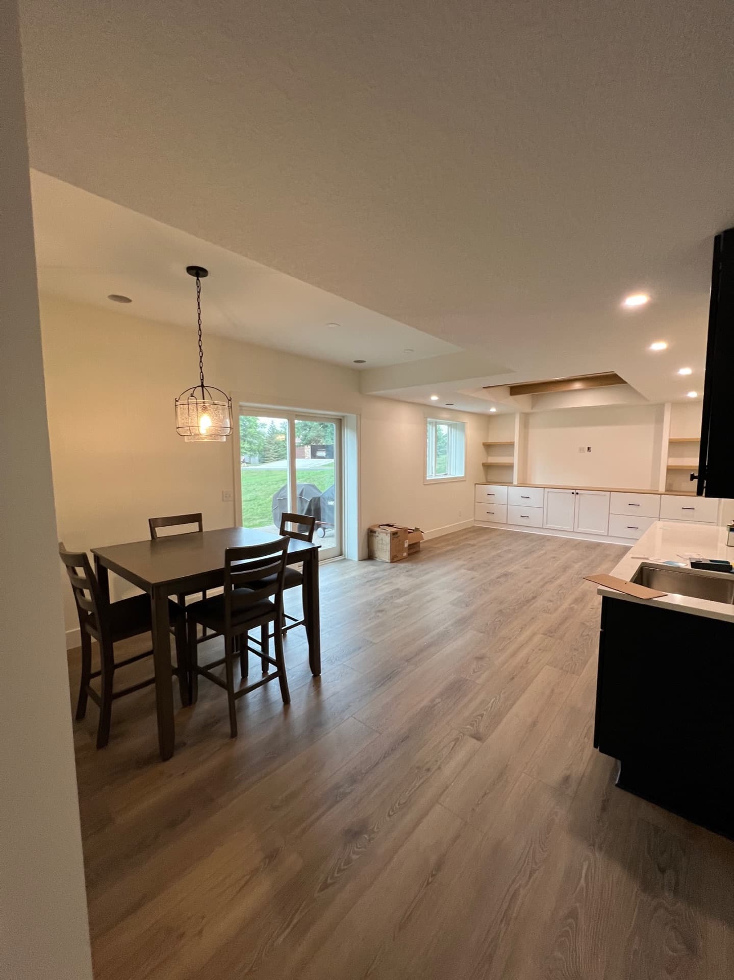 Basement living space with walkout by Seeger & Co